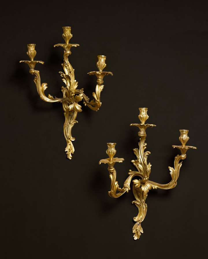 A PAIR OF LOUIS XV ORMOLU THREE-LIGHT WALL-APPLIQUES